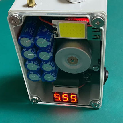 Arc igniter with lighting capability, mobile phone charging, hand-crank power generation, capacitor energy storage, and battery-free design